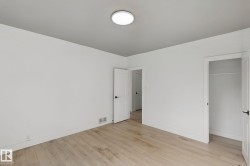 Light wood-finish flooring with white walls - 