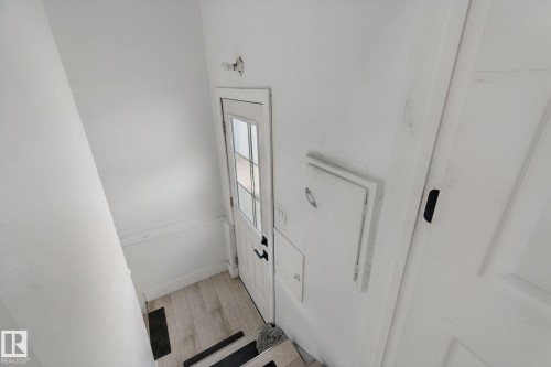 White paneled door with divided lite glass - 11914 124 Street Nw, Edmonton, AB 