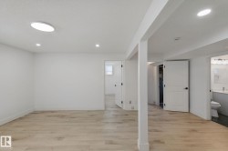Light wood-finish flooring with white walls - 