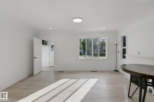White walls with recessed lighting and a flush-mount ceiling fixture - 11914 124 Street Nw, Edmonton, AB 
