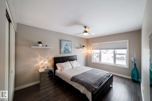 Wood-finish flooring, full-light window, and overhead ceiling fan - 12228 134 Street Nw, Edmonton, AB 