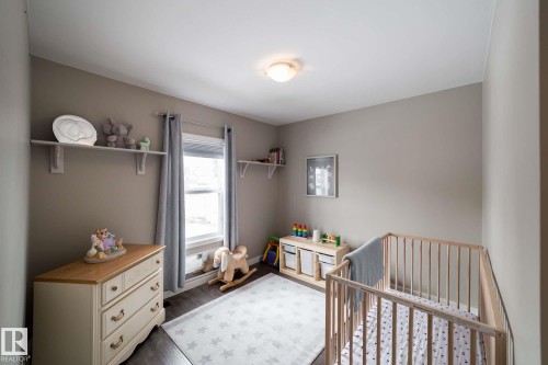 Wood-finish flooring with neutral wall tones - 12228 134 Street Nw, Edmonton, AB 