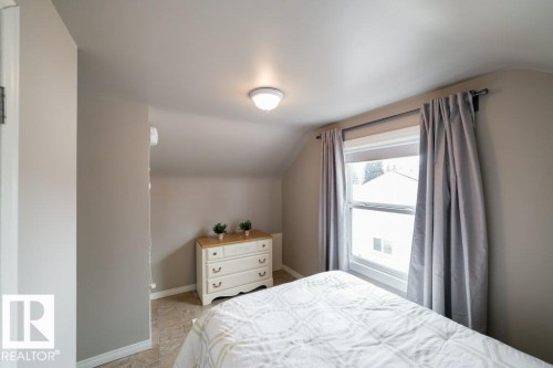 Vaulted ceiling, ceiling-mounted light fixture, window with roller shade, window with curtain rod - 12228 134 Street Nw, Edmonton, AB 