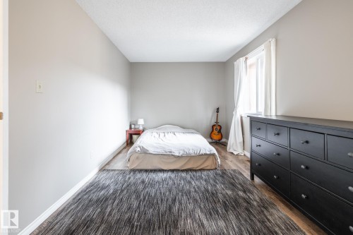 Neutral-toned interior with wood-finish flooring - #20 3812 20 Av Nw, Edmonton, AB 