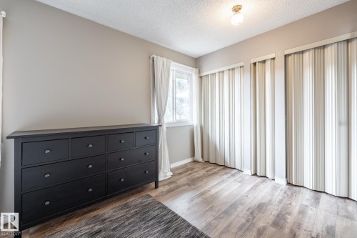 Room featuring light wood-finish flooring and neutral wall paint - #20 3812 20 Av Nw, Edmonton, AB 