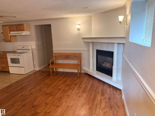 10 Weston Court, Spruce Grove, AB - Indoor Photo Showing Kitchen With Fireplace