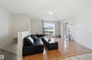 Hardwood flooring throughout the main living area - #85 150 Edwards Dr Sw, Edmonton, AB 