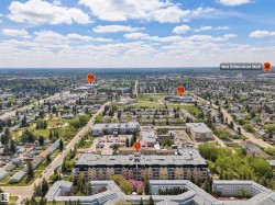 Aerial perspective of a developed urban area featuring multiple residential buildings and commercial structures - 