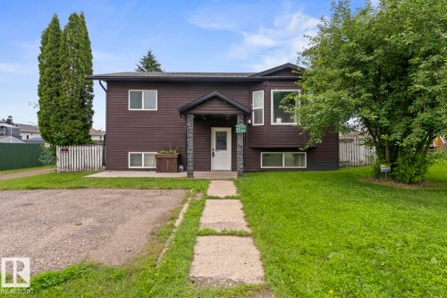 Split-level residence featuring dark brown siding and white trim - 4412 51 Avenue, Cold Lake, AB - Outdoor With Facade