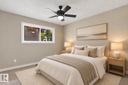 Neutral wall paint, plush carpet flooring, white trim, sliding window, and built-in closet with shelving - 9908 99 Street, Morinville, AB 