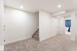 Spacious room featuring neutral carpeting and recessed lighting - 