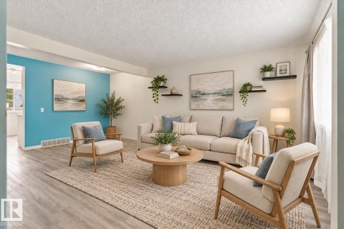 Expansive room with wood-finish flooring, accent wall, recessed lighting, and wall-mounted shelving - #3 18010 98 Av Nw, Edmonton, AB 