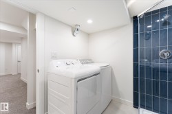 Dedicated laundry area with a full-size washer and dryer - 