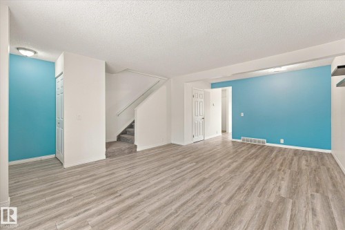 Wood-finish flooring throughout the main level - #3 18010 98 Av Nw, Edmonton, AB 
