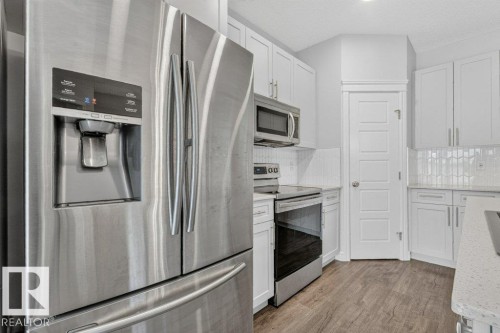 1064 Cy Becker Road Nw, Edmonton, AB - Indoor Photo Showing Kitchen With Stainless Steel Kitchen With Upgraded Kitchen