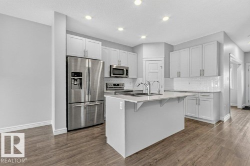 1064 Cy Becker Road Nw, Edmonton, AB - Indoor Photo Showing Kitchen With Stainless Steel Kitchen With Upgraded Kitchen