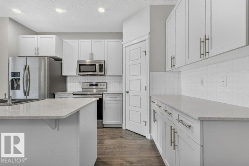 1064 Cy Becker Road Nw, Edmonton, AB - Indoor Photo Showing Kitchen With Stainless Steel Kitchen With Upgraded Kitchen