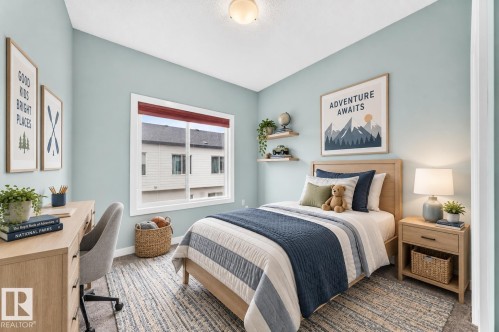 Window with red-toned blinds, two floating wall shelves, and a built-in light fixture - #56 804 Welsh Dr Sw, Edmonton, AB 