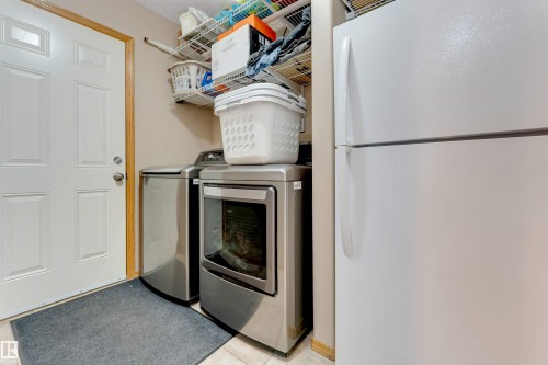 White paneled door with wood trim - 4510 164A Ave Nw, Edmonton, AB 