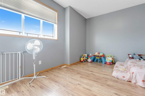 Wood-finish flooring with neutral wall tones - 4510 164A Ave Nw, Edmonton, AB 