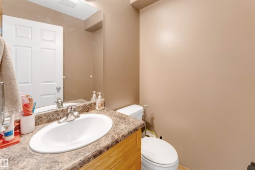 Vanity with an oval undermount sink, chrome faucet, and composite countertop - 4510 164A Ave Nw, Edmonton, AB 