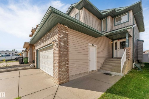 Multi-story exterior with siding and brick accents - 4510 164A Ave Nw, Edmonton, AB 