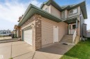 Multi-story exterior with siding and brick accents - 4510 164A Ave Nw, Edmonton, AB 