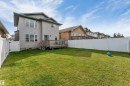 Expansive green lawn with a white privacy fence - 4510 164A Ave Nw, Edmonton, AB 