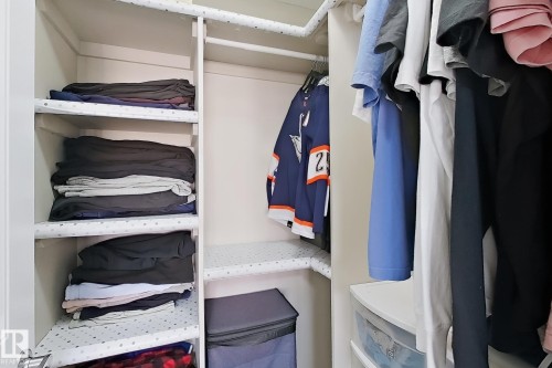 Built-in shelving units and hanging rods provide organizational options - 144 52 Street Sw, Edmonton, AB 