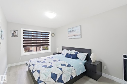 Light-colored walls, recessed lighting, and wood-finish flooring - 144 52 Street Sw, Edmonton, AB 
