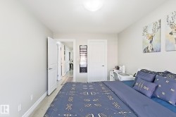Neutral wall color, light wood-finish flooring, white trim, and a flush mount ceiling light - 