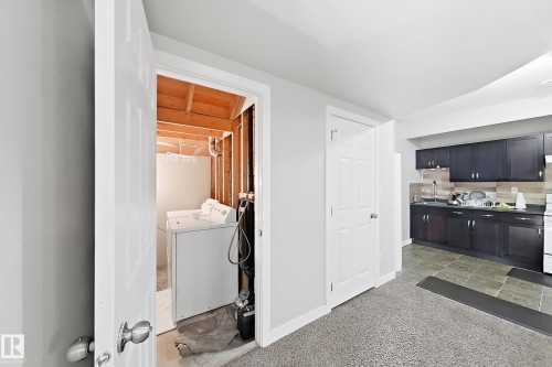 Laundry area with exposed wood framing - 144 52 Street Sw, Edmonton, AB 