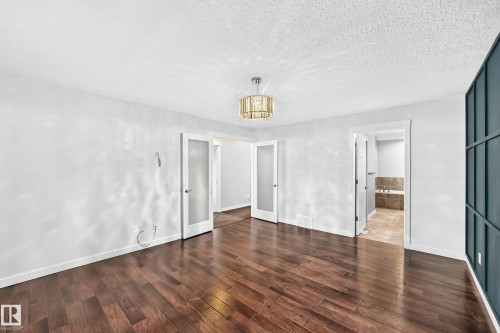 Wood-finish flooring throughout - 3329 West Court Nw, Edmonton, AB 