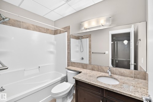 Integrated shower/tub combination with grab bar - 3329 West Court Nw, Edmonton, AB 