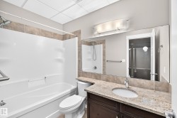Integrated shower/tub combination with grab bar - 