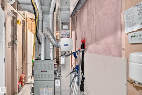 Installed HVAC system with ductwork and a humidifier unit - 3329 West Court Nw, Edmonton, AB 