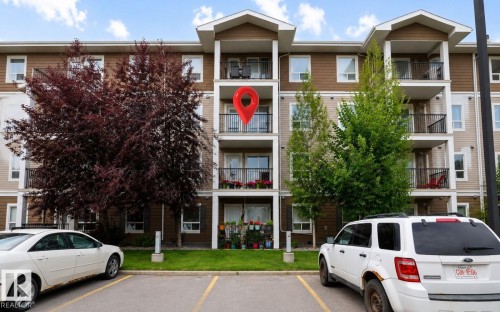 Parking still is under the balcony - #3303 9351 Simpson Dr Nw Nw, Edmonton, AB - Outdoor With Balcony With Facade