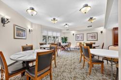 Recessed lighting, wall sconces, patterned carpet, window treatments, and built-in cabinetry - 