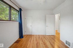 Hardwood flooring, white painted walls, ceiling fan, white interior doors - 