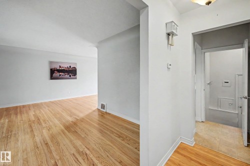 Hardwood flooring and light wall finishes throughout - 10830 138 Street Nw, Edmonton, AB 