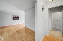 Hardwood flooring and light wall finishes throughout - 10830 138 Street Nw, Edmonton, AB 