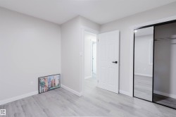 Light gray walls complement the wood-finish flooring - 