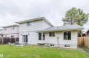 Expansive green lawn with a wood fence perimeter - 10423 35 Avenue Nw, Edmonton, AB 