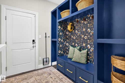 Built-in storage cabinetry with a bench, drawers, and shelving - 94 Westlin Drive, Leduc, AB 