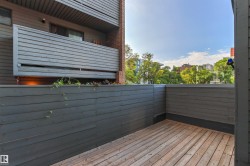 Wood-finish deck with privacy fencing and an open-air exposure - 