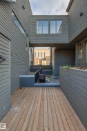 Wood-finish decking with a surrounding perimeter wall - 