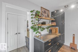 Custom cabinetry with open shelving, dark-finish base cabinets, and a durable countertop - 