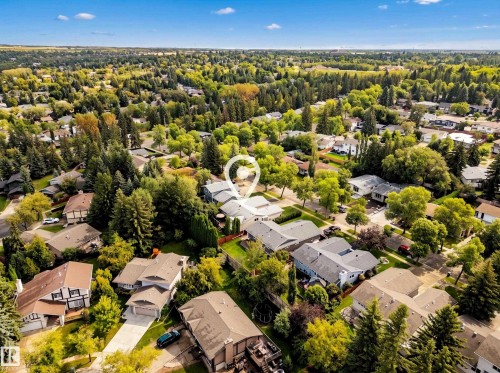 Aerial perspective showcasing the residential neighborhood with mature tree coverage - 11 Brunswick Crescent, St. Albert, AB 