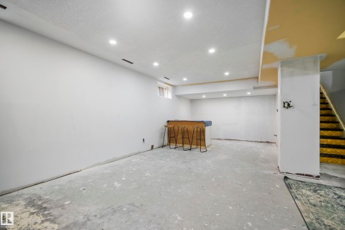 Recessed ceiling lighting, partially finished wall surfaces, exposed concrete flooring, and an unfinished ceiling - 11 Brunswick Crescent, St. Albert, AB 