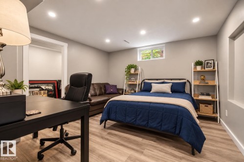 Recessed lighting, wood-finish flooring, and a window with white trim - 11 Brunswick Crescent, St. Albert, AB 